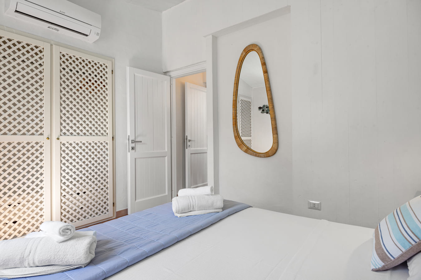 Bedroom with mirror and wardrobe